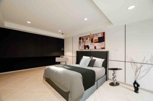 Modern bedroom with stylish decor and a comfortable bed