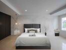 Modern bedroom with large bed and minimalistic decor