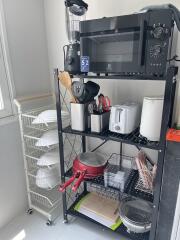 Kitchen storage area with appliances and utensils