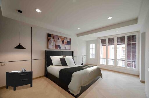 Spacious modern bedroom with large windows