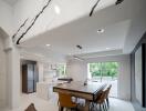 Modern kitchen and dining area with large table and sleek design