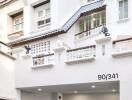 Facade of a white multi-story residential building