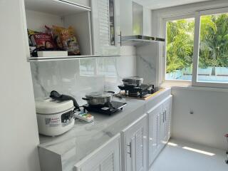 Modern kitchen with appliances and natural light