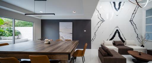 Modern living room with a large wooden dining table