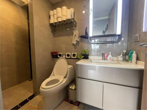 Modern bathroom with vanity and toilet.