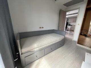 Bedroom with a single bed and built-in drawers