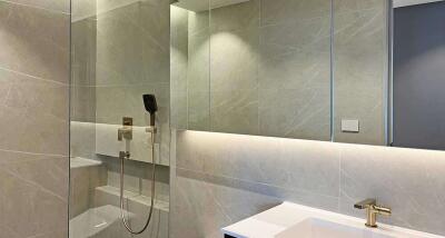 Modern bathroom with glass shower and large mirror