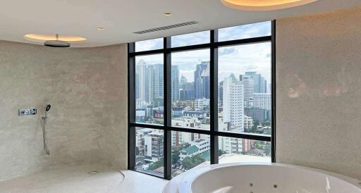 Spacious bathroom with a panoramic city view