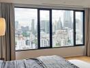 Bedroom with panoramic city view