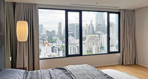 Bedroom with panoramic city view