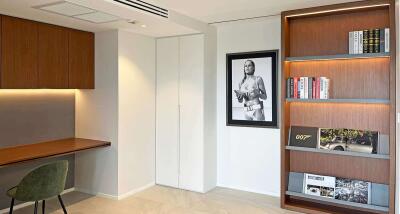 Modern study room with wooden desk and bookshelf