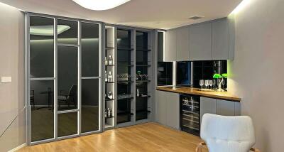 Modern kitchen with built-in cabinets and glass shelves