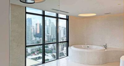 Modern bathroom with large window and city view