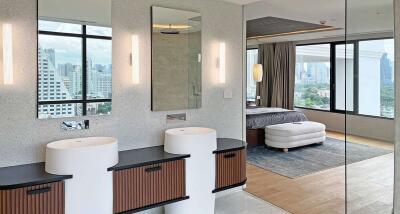 Modern bedroom with en-suite bathroom and city view