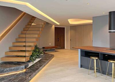 Modern living area with staircase and kitchen island