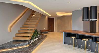 Modern living area with staircase and kitchen island