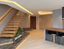 Modern living area with staircase and kitchen island