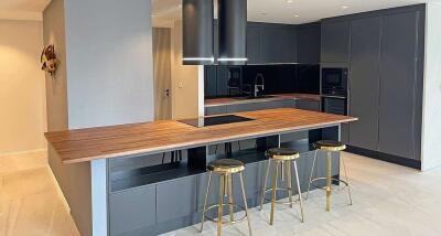 Modern kitchen with island and bar stools