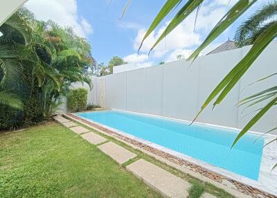 Private swimming pool with surrounding garden area