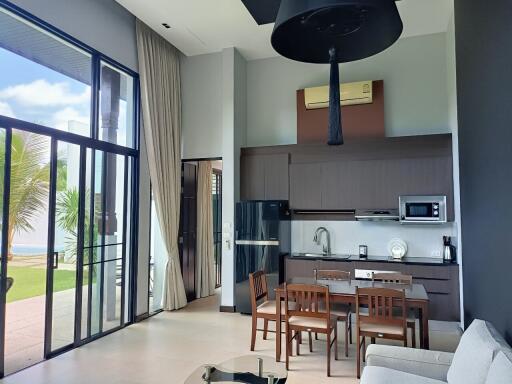 Modern living area with kitchen and large windows