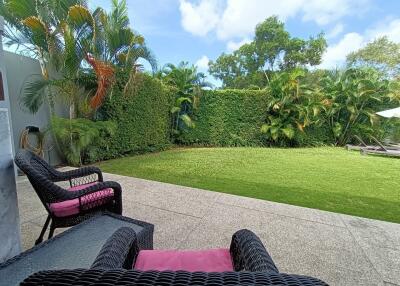 Spacious backyard with lush greenery