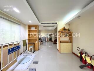 Spacious living area with natural light and modern decor