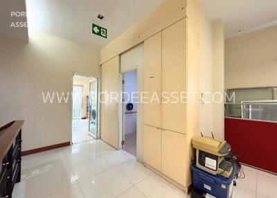 Interior view of a corridor with beige cabinets