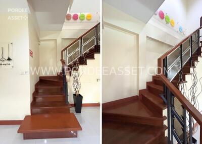 Staircase area with decorative wall features and wooden steps