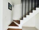 Modern staircase with wooden steps and minimalist design