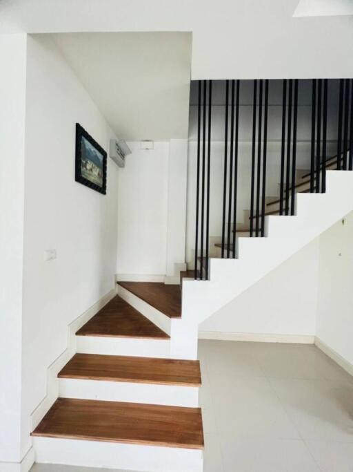 Modern staircase with wooden steps and minimalist design