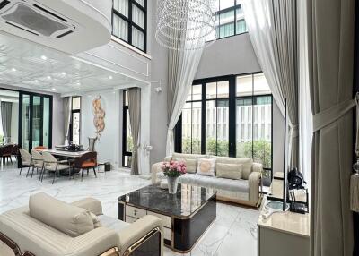 Luxurious living room with high ceilings and modern decor