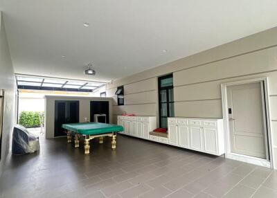 Spacious recreational room with a pool table