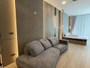 Modern living room with grey sofa and ambient lighting