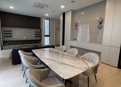 Modern dining room with marble table and upholstered chairs