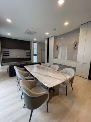 Modern dining room with marble table and upholstered chairs