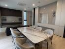 Modern dining room with marble table and upholstered chairs