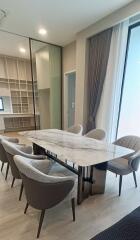 Modern dining room with marble table and upholstered chairs