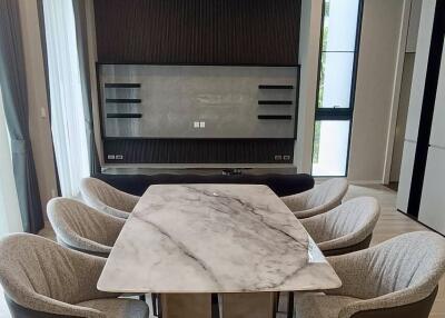 Modern dining room with marble table and upholstered chairs