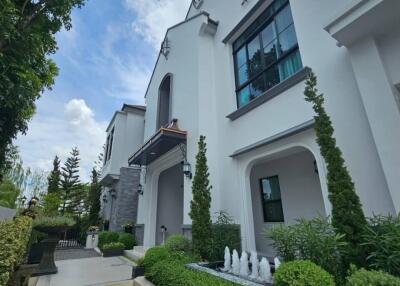 Front view of a modern house with landscaped garden