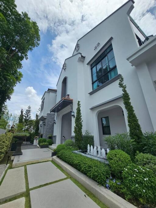 Front view of a modern house with landscaped garden