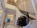 Elegant foyer with piano and chandelier