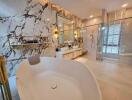 Luxury master bathroom with marble wall and freestanding bathtub