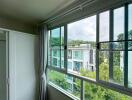 Bedroom with a large window offering a scenic view