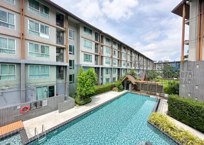 Modern apartment complex with a swimming pool