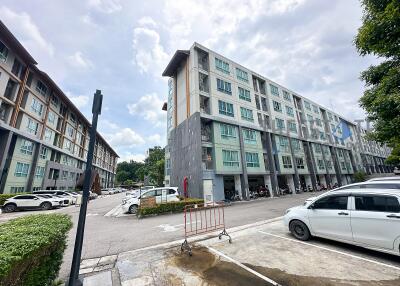 Modern apartment buildings with parking space and greenery