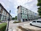 Modern apartment buildings with parking space and greenery