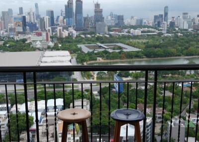 Scenic view from the balcony overlooking the city skyline and greenery