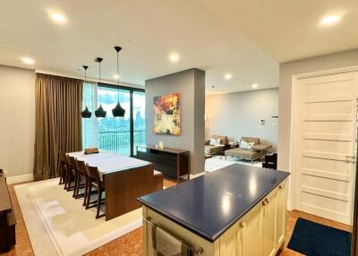 Open-concept living area with kitchen, dining, and seating spaces