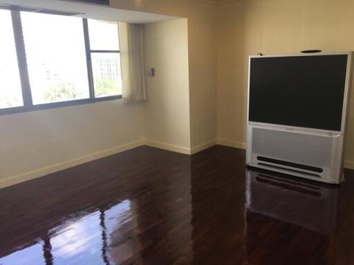 Living room with large window and television