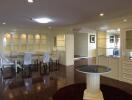 Elegant dining area with glass cabinets and a circular table